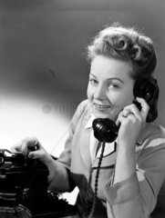Woman answering the telephone  1948.