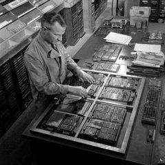 A compositor making up type  1954.