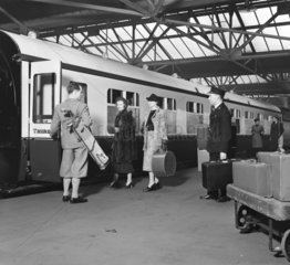 Passengers boarding a train  1936.