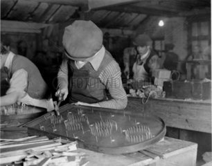 'Making Corinthian Bagatelle Boards at their Hoxton factory'  1932.