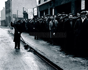 Queue of unemployed men  London  12 December 1938.