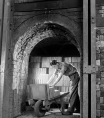 Unloading furnace bricks from kiln  Jarrow  1957.