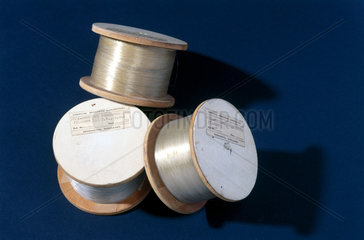 Three spools of polyethylene terephthalate filaments  1943-1944.