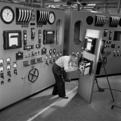 An electronic engineer assembles a control panel installation  Luton  1957.