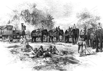 The arrival of a railway locomotive in India  1875.