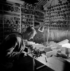 A pattern maker makes wood blocks for a new British Rail line casting. 1967.