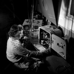 A female worker testssound projector  Mitcheldean  1956.