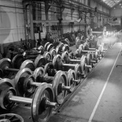Rows of large milled steel wheels ready to be fitted to locomotives  Preston.