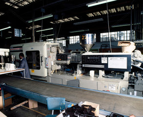 Automic 'Negri Bossi' injection moulding machine and operator  c 1985.