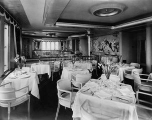 View of dining room of Cunard liner  9 April 1954.