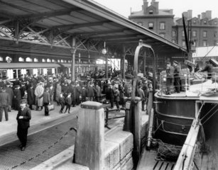 Passengers disembark from the SS 'Cedric'  1909.