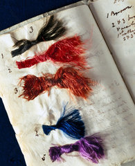 Booklet of coloured silk threads  c 1825-1844.