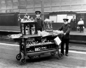 Two attendants with a refreshments trolley  1915.