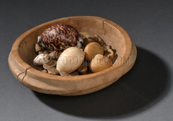 Bowl containing bones  nuts and shells  South African  1890-1924.