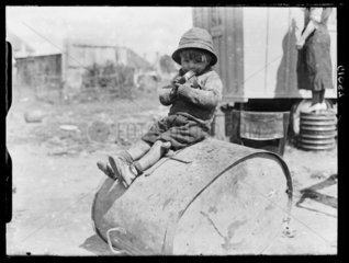 Child in a Romany encampment  Crawley  Sussex  24 May  1938.