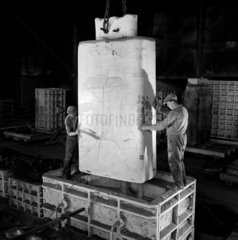 An Iron foundry section core being put into box before casting  Head Wrightson.