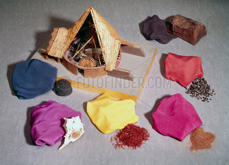 Natural dyes shown with dyed fabrics and a model of a woad mill.