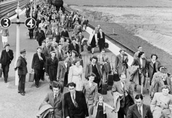 Passengers leaving a train  c 1950.