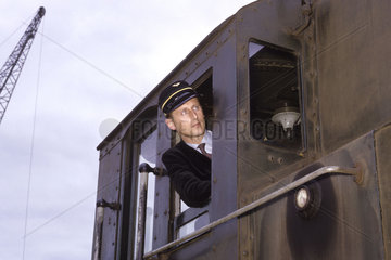Driver looking out of locomotive cab  Rotterdam  Netherlands  July 1962.