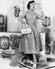 Woman with fake coins  1950s.