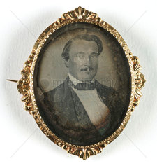 Small portrait of a man contained in a brooch  mid-late 19th century
