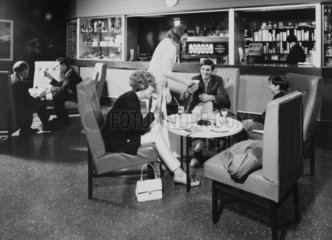 People in a bar at a Motorail terminal  c 1966.