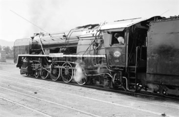 A 15F class locomotive and passenger train  Pretoria  South Africa  1968.