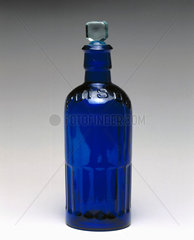 Blue glass reagent bottle with 'POISON' embossed on the neck  1930.