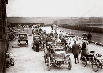 Motor cars parked outside a country house during the 1000 Mile Trial  1900.