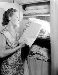 Woman by an airing cupboard  1949.