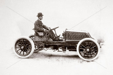 C S Rolls at the wheel of his 80 hp Mors Racer  c 1903.