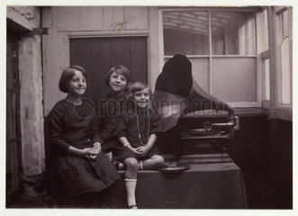 Three girls with a gramophone  c 1925.