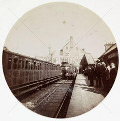 Train at a railway station  London  c 1890.
