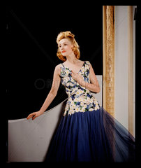 Woman wearing an evening dress  c 1940.