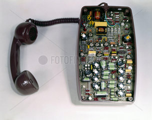 Sectioned view of telephone with handset  c 1960.