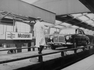 Car being driven onto a Motorail service  c 1966.