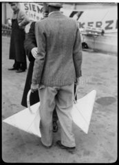 Man carrying two wheel fairings  Berlin  1932.