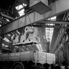 A crane lowers a finished Radicon gearbox on to truck   David Brown  1958.