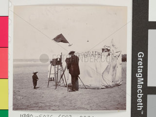 Snap-shot of a beach photographer at Whitby  North Yorkshire  c 1900s.