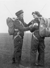 Royal Air Force para-nurses tying on their