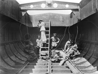 Soldiers welding together sections of a boat  19 September 1918.