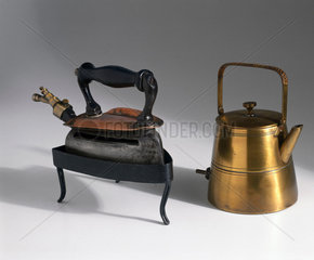Brass electric kettle c 1910  and iron  c 1930.