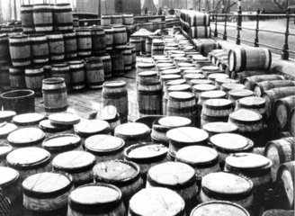 Storage barrels for fish lined up and stack