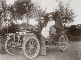 C S Rolls with a female companion sitting in his 15 hp Panhard  1903.