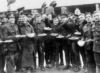 Soldiers of Kitchener's army with their Christmas dinner  1914-1918.