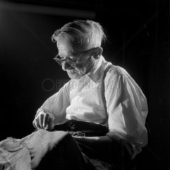 Portait of elderly tailor at work  Montague Burton  Guisborough  1960.