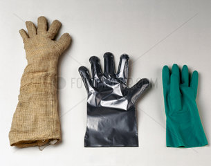 Three protective gloves  c 1982-1996.