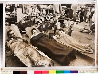 Workers asleep on the factory floor  1969.