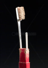 Toobrush set  in rectangular red leather tooled pull off case  1791-1792.