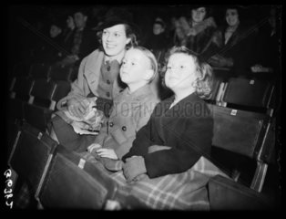 Family watching a circus rehearsal  1938.